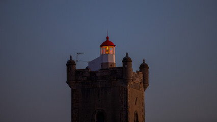 lighthouse shinning at night in Carcavelos
