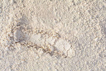 Close up of organic white natural clay powder for face mask, face cream, body wrap, selective focus. Abstract background