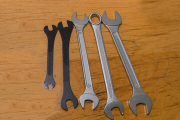 Wrench keys on the table. Turning hand tools for workers.