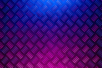 Metal background in the neon lights top view.