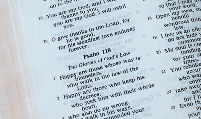 The Law of God, psalm 119, open Holy Bible Book closeup. The Christian biblical concept of glory...