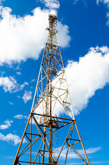 Tower for the transmission of mobile communications. Radio antenna Tower , microwave antenna tower on light sky background. Wireless technology concept.