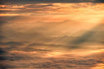 Sunrise shining on mountain with foggy in the valley at national park