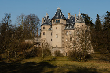 Fototapeta na wymiar Old castle with a beautiful spring park in Goluchow, Poland. Travel in Europe.