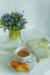 cup of tea and a bouquet of flowers