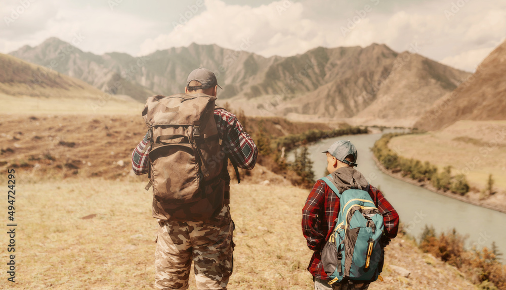 Wall mural father and son hiking in the countryside