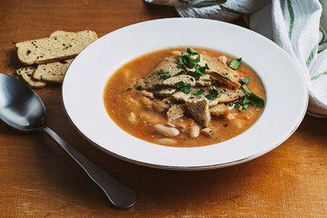 Bowl of lentils soup with beans
