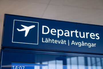 Closeup of an airport direction sign. Terminal, departures