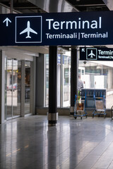 Closeup of an airport direction sign. Terminal, departures