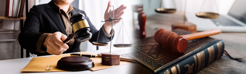 Male lawyer working with contract papers and wooden gavel on tabel in courtroom. justice and law ,attorney, court judge, concept.