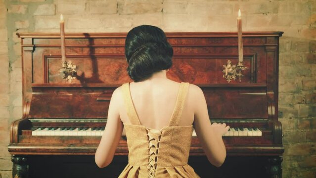 old film style. Silhouette elegant romantic young retro woman. Gently touches key play music piano. evening party roar 20s. Lady finger wave historical hairstyle back rear view. vintage room back view
