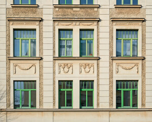 Renovated classic house facade windows pattern with green frame, Saxony, Germany