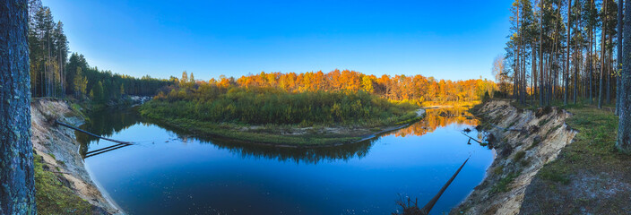 background photo panoramic view of the Bolshaya Kokshaga river with pine trees on the banks, in good weather, Mari El, Volga region, Russia