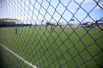 salvador, bahia, brazil - february 18, 2022: protective metal net on a soccer field in the city of...