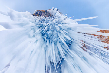 Banner blue clear ice cave on Baikal lake in winter landscape © Parilov