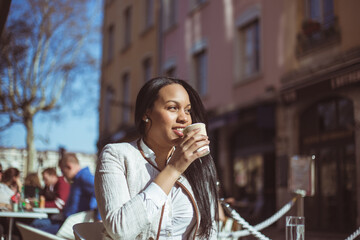 young woman enjoying coffee before work