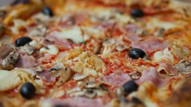 Pizza capricciosa. Pizza with ham, olives, mushrooms and artichokes.