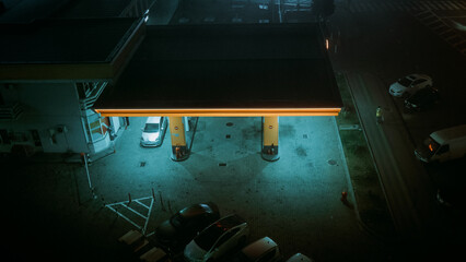 Gas station at night with blue light. Atmospheric photo. Refueling the car. High quality photo