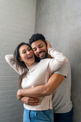Portrait of happy multiethnic couple enjoying romantic moments together.