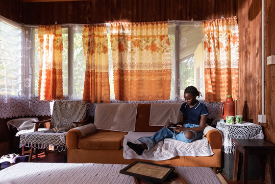 Portraits of teenager relaxing in a rural sitting room 