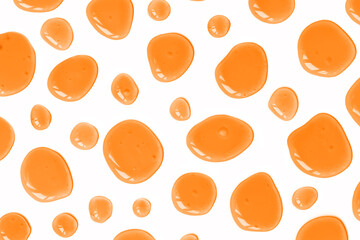 Orange colored doses of acid, hyaluronic moisturizing serum or gel isolated on white background. Abstract backdrop pattern. Beauty product wallpaper. Cosmetics or healthcare protection concept. 