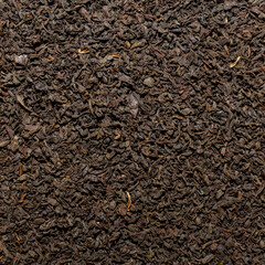 Photo of closeup texture of black dry tea, background