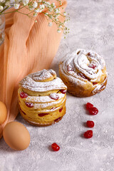 Easter cake cruffin. Cruffins with dried cherries, sprinkled with powdered sugar.