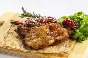 Grilled pork loin served onion