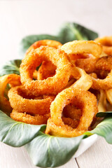 Fried squid rings breaded with lemon on a plate