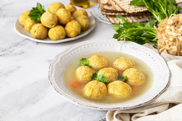Fototapeta na wymiar Matzoh ball soup. Jewish traditional cuisine Passover food 