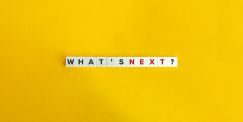 What’s Next Question on Letter Tiles on Yellow Background. Minimal Aesthetics.