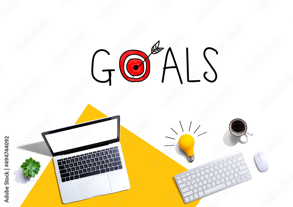Poster goal concept with computers and a light bulb