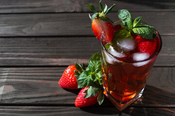 fresh strawberry lemonade on a dark wooden background