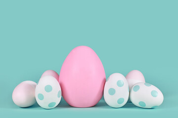 Pink and mint green easter eggs with dots