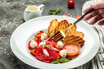 salad with fresh tomato mozzarella, onion and olive oil. Uzbek cuisine banner, menu, recipe place for text, top view