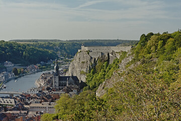 Naklejka premium Aerial view on the city of the citadel and church of Dinant along river meuse