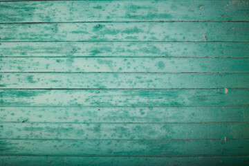 Obraz premium old blue wooden fence with peeling paint