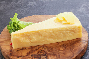 Parmesan cheese piece over board