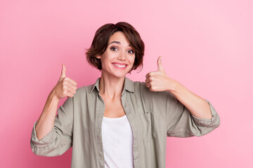 Photo of positive attractive lady show thumb up symbol suggest perfect shopping offer isolated over...