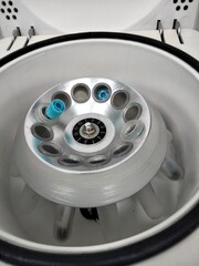 Centrifuge with blue test tubes in the immunological laboratory
