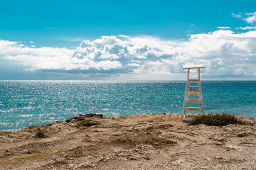 Isolated white safeguard post between two beaches in Torrox Costa area. Beautiful landscape in a...