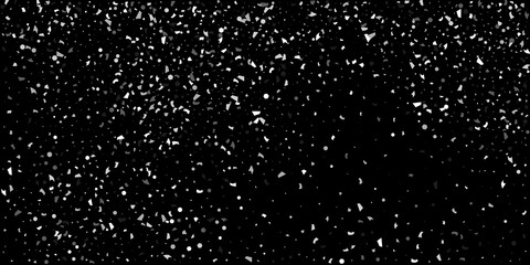 Silver grainy abstract texture overflows against a black background. Element of design.