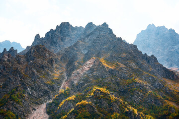 Pointed peaks of mountains with a tourist trail. Tsei Gorge North Ossetia, spring.