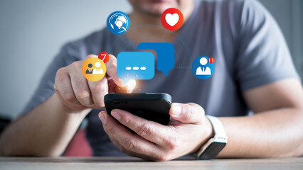Social media and digital online concept, man using smart phone at home. The concept of living on vacation and playing social media. Modern graphic interface showing online social connection network