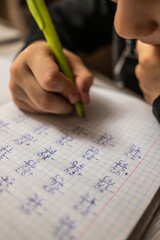 Mathematical examples that the student writes and solves. Sum and subtraction. Algebra. Pen and...