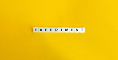 Experiment Word on Letter Tiles on Yellow Background. Minimal Aesthetics.