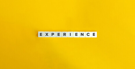 Experience Word on Letter Tiles on Yellow Background. Minimal Aesthetics.