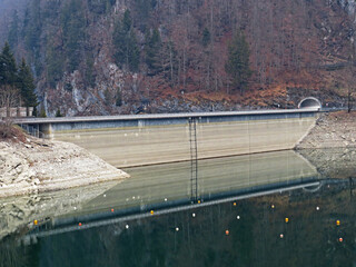 The dam on the artificial alpine Lake Wägitalersee (Waegitalersee or Wagitalersee), Innerthal -...