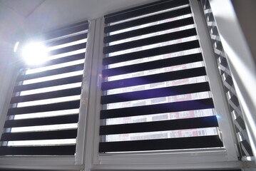 sunlight breaks through the blinds