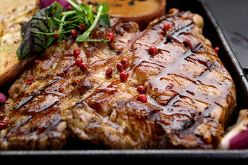 Pork steak with potatoes, spices and sauce
